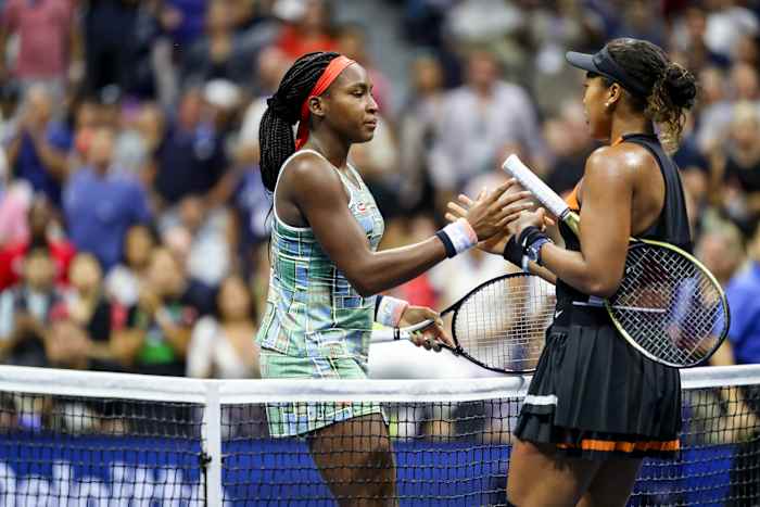 Naomi Osaka (right) and an end-of-her run Coco Gauff head in for a shake and a hug following a fourth-round U.S. Open match last August.